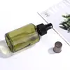 Botella Negra de Fábrica con Bomba de Hombro Inclinado 120ml Botella a Prueba de Luz Botella con Atomizador Sub-Botella Cosmética 50ml