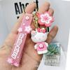 Nuevo llavero de dibujos animados de flor de cerezo Sanrio, colgante de muñeca, llavero para coche, colgante, adornos colgantes para bolso de pareja