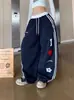 Pantalones de chándal de pierna recta para mujer Temporada de primavera y otoño 2025 Azul marino Versátiles de pierna ancha Deportivos Sueltos Caídos Hasta el suelo Modernos