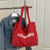 Bolso de lona con estampado de letras para mujer, estilo dopamina, bolso de mano portátil japonés y coreano, bolsa de compras, bolsa de mano estilo perezoso de Instagram para estudiantes