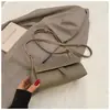 Bolsa Pequena Texturizada Retrô Transfronteiriça para Mulheres 2026 Novo Estilo Simples e Elegante Bolsa Almofada Bolsa de Ombro Transversal Retrô de Nicho