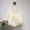 Bolsa de Tricô Tecida com Flor Vazada Estilo Preguiçoso para Mulheres 2026 Novo Estilo Bolsa Tote de Ombro Único Grande Capacidade Bolsa Casual