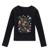 Camiseta negra de cuello redondo y manga larga para mujer, nuevo estilo primavera y otoño, estampado floral de dibujos animados, corte ajustado, top moderno