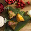 Hojas de Zongzi Cang Yi Da Fa Frescas Tamaño Grande Hojas Nuevas Hojas Especiales para Envolver Zongzi Festival del Bote del Dragón Bolsas al por Mayor Zongzi Secos