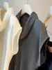 Nuevo estilo de principios de otoño, elegante top de punto sin mangas con cuello de volantes para mujer, corte ajustado y favorecedor para la figura con mangas cruzadas