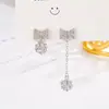 Aretes Largos Asimétricos de Plata 925 con Circonita en Forma de Lazo Estilo Coreano Lujo Ligero Personalizados de Nicho Antialérgicos para Mujer