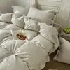 2026 Novo Conjunto de Roupa de Cama de Algodão Lavado Conjunto de Quatro Peças Estilo Muji Listrado Botão Tecido Colorido Jacquard Casa Quarto Conjunto de Quatro Peças