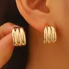 Pendientes Minimalistas Europeos y Americanos Transfronterizos de Superficie Lisa de Alta Gama con Diseño de Textura Única en Forma de C para Mujer