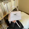 Bolso Kelly de Alta Gama para Mujer, Nuevo Bolso de Mano y Bolso Cruzado de Moda Verano 2026, Diseño de Nicho, Bolso Pequeño Cuadrado para el Trabajo