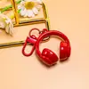 Nuevo llavero creativo de auriculares 3D, un accesorio moderno y genial para bolsos, joyería hecha a mano para manualidades y materiales para accesorios, al por mayor