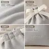 Bolsa de terciopelo con cordón para joyería, anillos y collares, con cierre de cordón y diseño de lazo de cinta. Impresión de logo personalizada disponible