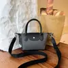 Bolsas de tela Oxford con bloques de color simples transfronterizas Bolsa de mano Xiangjiao tipo empanada versátil de nicho bolso de mano con textura de moda bolso de hombro