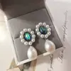 Nuevos pendientes de mujer de moda para comercio electrónico transfronterizo europeo y americano: perla natural, moda vintage popular, aretes creativos para dama