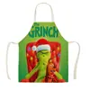 Delantal de Navidad nuevo Grinch de pelo verde delantal de Navidad transfronterizo sombrero rojo decoración navideña niños un lote