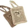 Nova bolsa de mão feminina trançada vazada transfronteiriça, bolsa de ombro, bolsa de palha de verão, bolsa tote de grande capacidade, bolsa de letras para férias