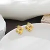 Pendientes elegantes y únicos de moda europea y americana transfronteriza, pendientes de botón cuadrados de piedra ojo de gato de alta gama para mujer de nicho
