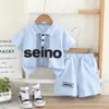 Ropa de Verano para Niños de Comercio Exterior 2026 Nuevo Estilo Conjunto de Dos Piezas Polo de Manga Corta con Bloques de Color para Niños Venta al por Mayor