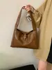 Bolso de axila de cuero suave retro para mujer 2025 Otoño e Invierno Nuevo de gran capacidad Bolso de hombro simple Bolso baguette de mano