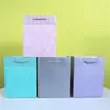 Processo Duplo de Hot Stamping e Relevo Cartão Branco 210g Bolsa de Papel Pronta para Venda Atacado Sacola de Compras de Papel Prata Quente com Cartão para Pendurar