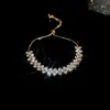 Pulsera Trenzada Hebilla de Herradura Redonda de Circonita Roja Europea y Americana Diseño de Nicho Pulsera Exquisita de Gama Alta para Mujer