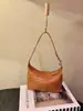 Bolsa de Palha Tecida Primavera/Verão 2026 Simples Retalhos de Couro de Vaca Casual para o Dia a Dia Versátil Bolsa Pequena Atacado Couro de Vaca de Primeira Camada
