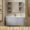Tocador de baño engrosado y ahorrador de espacio con diseño en color crema, que cuenta con un lavabo redondeado, lavabo cerámico integrado y un lavabo de una sola pieza.