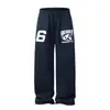 Pantalones azules anchos y curvos bordados estilo americano para hombre, adecuados para primavera y otoño, con corte relajado, versátiles y casuales, joggers gruesos