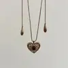 2026 Nova Venda Quente Colar Pingente Coração Vazado de Zircônia Corrente de Clavícula Simples Fashionável Colar de Nicho Exquisito para Mulheres