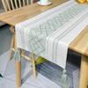 Camino de mesa de algodón y lino con borlas de jacquard transfronterizo, mantel largo de jacquard de rombos nórdicos, mesa de té navideña, mueble de cine, camino de mesa al por mayor