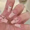Uñas postizas ponibles con un toque de alta gama, populares en línea, manicura de lazo, lindo diseño de corazón girly, uñas estilo dulce y puro deseo