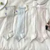 Meias femininas de primavera e verão com estampas florais geométricas, meias até a panturrilha combinadas com sapatos de couro pequenos, polainas sem pé versáteis