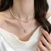 Colar multicamadas de pérolas luxuoso, requintado e elegante com alto brilho para mulheres, corrente de clavícula floral de pérolas estilo Chanel, versátil para o uso diário