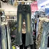 Jeans Feminino 2026 Primavera e Outono Novo Design Emagrecedor de Cintura Alta High-Street Bainha Desfiada Levemente Flare