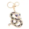Llavero Animal Zodiacal Serpiente Colgante Pequeño Pedrería Metal Portador de Fortuna Cordón de Cuero Decoración de Año Nuevo Llavero Venta al por Mayor
