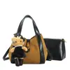 Moda coreana y japonesa gamuza alta gama gran capacidad 2026 otoño nuevo bolso de hombro único bolso cruzado tipo cubo