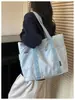 Bolsa de Ombro Único com Bordado de Laço 2026 Nova Outono/Inverno Grande Capacidade Bolsa Tote para Trabalho e Trajeto Bolsa de Braço da Moda para Mulheres
