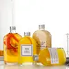 Botella de vidrio para bebidas al por mayor 250 ml botella de vino de frutas botella de jugo botella de té de leche botella de enzimas botella de vino pequeña se puede imprimir logotipo