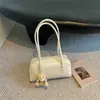 Bolsa de almohada de color sólido retro estilo coreano, bolsa de mano tipo bowling única, nueva bolsa de hombro simple de alta moda para 2026