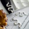 Nueva joyería de uñas de aleación de serpiente y escorpión transfronteriza, pegatinas de uñas negras con pistola de oro y plata, joyería de uñas de Buda tridimensional al por mayor