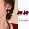 Pendientes de botón de lazo de terciopelo rojo perla Shijia de otoño e invierno nuevos pendientes de moda pendientes de diseño de nicho femenino