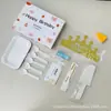 Conjunto de acessórios para bolo Fábrica Ningjin conjunto de sete peças em caixa velas de aniversário chapéu de coroa faca garfo prato de plástico descartável
