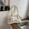 Bolsa retro de nicho para motocicleta para mujer, nuevo modelo de otoño 2026, bolsa de hombro y axila de alta gama de gran capacidad para el día a día