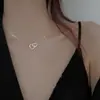 Collar de amor de doble anillo para mujer, temperamento de nicho, estilo frío, cadena para la clavícula, hebilla de anillo simple a la moda, colgante en forma de corazón