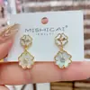 Pendientes de concha geométrica de estilo nicho de lujo ligero para mujer, diseño coreano, pendientes de botón versátiles exquisitos para el trabajo