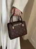 Bolso tipo Duchess de patrón de diamantes estilo Chanel pequeño para mujer 2026 nuevo de cuero genuino tacto de alta gama bolso de mano diseño de nicho bolso bandolera transfronterizo