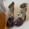 Diseño de nicho estilo vintage 2026 otoño e invierno nueva moda botas vaqueras para mujer con lazo de lona de tubo corto botas de montar