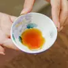 Taza de té blanca como la roca, hecha en fábrica, pintada a mano con patrones florales morados, taza de té especial para la fortuna y la prosperidad, taza de maestro, juego de té Kung Fu, taza de degustación