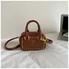 Bolso Pequeño de Color Sólido con Remaches Metálicos Vintage 2026 Nuevo Bolso Cruzado para Niñas, Bolso de Hombro Ligero de Alto Valor