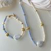 Collar de perlas barrocas de un solo color con ambiente francés para mujer, adornado con bolas doradas, Lingyun, pulsera extraíble cómoda.