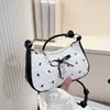 Bolsa Color Blocking Meia-Lua com Laço Rosa 2026 Novo Estilo Doce Cool Menina Apimentada Nicho Ombro Único Transversal Sob o Braço